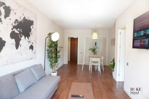 a living room with a couch and a table at Chamartin Centro Norte Apartment in Madrid