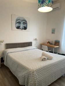 Posteľ alebo postele v izbe v ubytovaní Nonna Pina Art Rooms