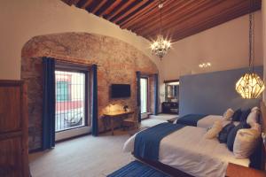 Postel nebo postele na pokoji v ubytování Hotel Boutique Casa Altamira