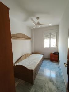 Postel nebo postele na pokoji v ubytování Apartamentos Séneca junto al Centro