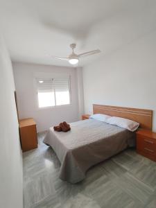 Postel nebo postele na pokoji v ubytování Apartamentos Séneca junto al Centro
