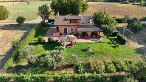 an aerial view of a house in a field at Dreams Valley in Valmontone