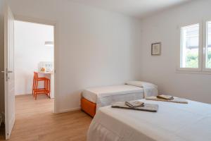 Ένα ή περισσότερα κρεβάτια σε δωμάτιο στο Villa Le Tre Muse Beach +77 φωτογραφίες