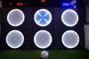 a wall with four white circles on it with a soccer ball at HOTEL NEST in Bijeljina