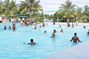 a group of people in a swimming pool at Fun City Water & Theme Park in Dar es Salaam