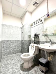 a bathroom with a toilet and a sink at An's House In Phan Rang in Kinh Dinh +27 photos