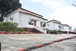 a car parked in front of a house at Fun City Water & Theme Park in Dar es Salaam
