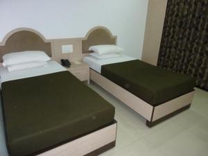 Postel nebo postele na pokoji v ubytování Hotel Balwas International
