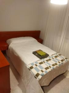 En eller flere senge i et værelse på Alojamiento caral