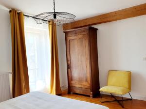 Postel nebo postele na pokoji v ubytování Gîte Le Pavillon Vougeot - Romanée - SPA