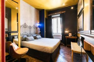 Una cama o camas en una habitación de Appartamenti MarcoAurelio49 37 fotos más