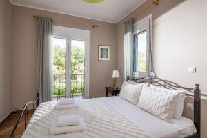Postel nebo postele na pokoji v ubytování Villa Chloe + 32 fotografií