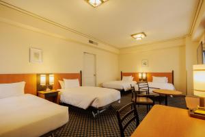 Postel nebo postele na pokoji v ubytování Hotel Monterey Sendai