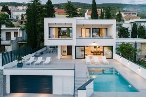 an image of a house with a swimming pool at Villa XeMa in Dramalj