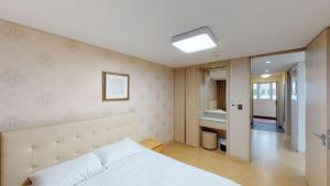 Postel nebo postele na pokoji v ubytování High1 Condominium