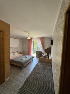 Postel nebo postele na pokoji v ubytování Good House Yaremche
