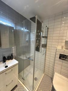 a bathroom with a shower and a sink at Mazurski klimat in Ełk