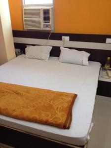 Postelja oz. postelje v sobi nastanitve Hotel Viraat Inn