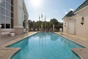 a swimming pool in the backyard of a house at Homewood Suites by Hilton Raleigh-Durham Airport at RTP in Durham