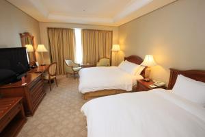 High1 Grand Hotel Main Tower的电视和/或娱乐中心