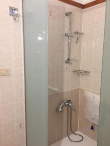 a shower with a glass door next to a sink at Apartamento Puerto Tazacorte in Puerto de Tazacorte +23 photos