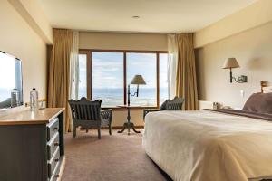 Cama ou camas em um quarto em Wyndham Garden Ushuaia Hotel del Glaciar