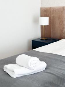 Posteľ alebo postele v izbe v ubytovaní Aparthotel Weissa 7