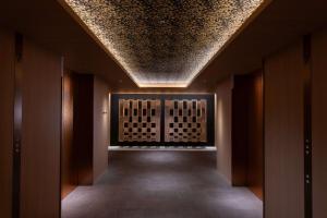 a hallway with a ceiling in a building at Hilton Kyoto in Kyoto