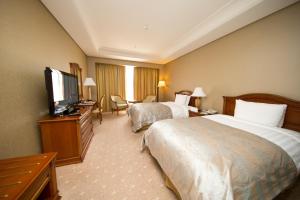 High1 Grand Hotel Main Tower的电视和/或娱乐中心