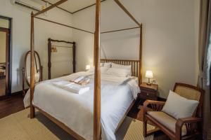 Ένα ή περισσότερα κρεβάτια σε δωμάτιο στο Villa de Pruek Chiang Mai