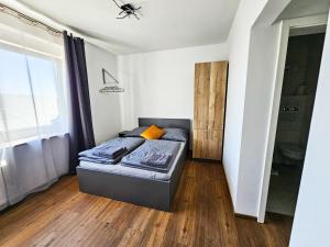 Postel nebo postele na pokoji v ubytování Werwein Stay + 19 fotografií