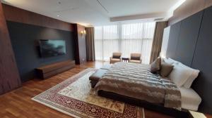 High1 Grand Hotel Convention Tower客房内的一张或多张床位