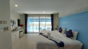 Postel nebo postele na pokoji v ubytování Phuket Racha Kata Homestay