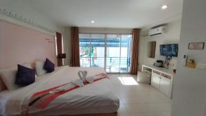 Postel nebo postele na pokoji v ubytování Phuket Racha Kata Homestay