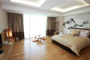 High1 Grand Hotel Convention Tower客房内的一张或多张床位