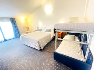 Postel nebo postele na pokoji v ubytování Hotel Bolognese