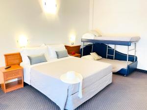 Postel nebo postele na pokoji v ubytování Hotel Bolognese