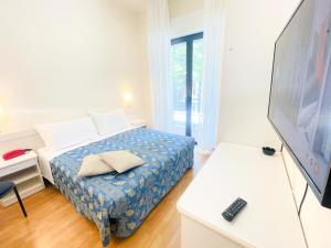 Postel nebo postele na pokoji v ubytování Hotel Bolognese