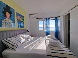 Postel nebo postele na pokoji v ubytování Apartments Šimun