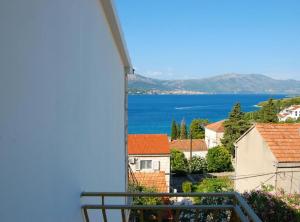 a view of the ocean from a balcony at Apartment Jurišić Korčula in Korčula