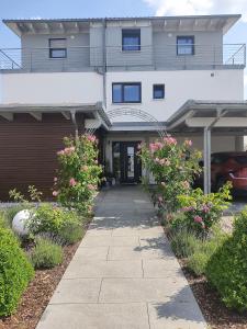 a building with pink flowers in front of it at Apartment Schwäbisch Hall in Schwäbisch Hall