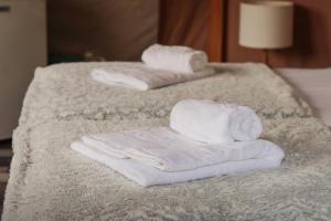 two towels sitting on top of two beds at Domaine du Heidenkopf in Niederbronn-les-Bains +72 photos