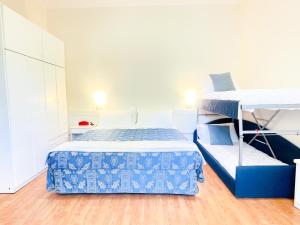 Postel nebo postele na pokoji v ubytování Hotel Bolognese