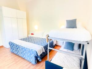 Postel nebo postele na pokoji v ubytování Hotel Bolognese