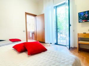 Postel nebo postele na pokoji v ubytování Hotel Bolognese