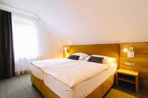 Postel nebo postele na pokoji v ubytování Hotel SKI