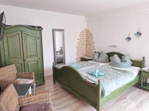 Postel nebo postele na pokoji v ubytování Pension zum Meer