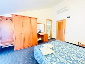 Postel nebo postele na pokoji v ubytování Hotel Bolognese