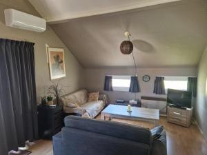 Χώρος καθιστικού στο Mon chalet en Ariège avec piscine