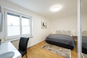 Postel nebo postele na pokoji v ubytování City Apartment Süd